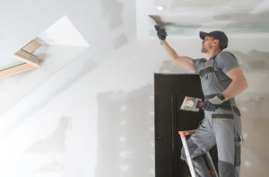drywall being installed by professional drywaller
